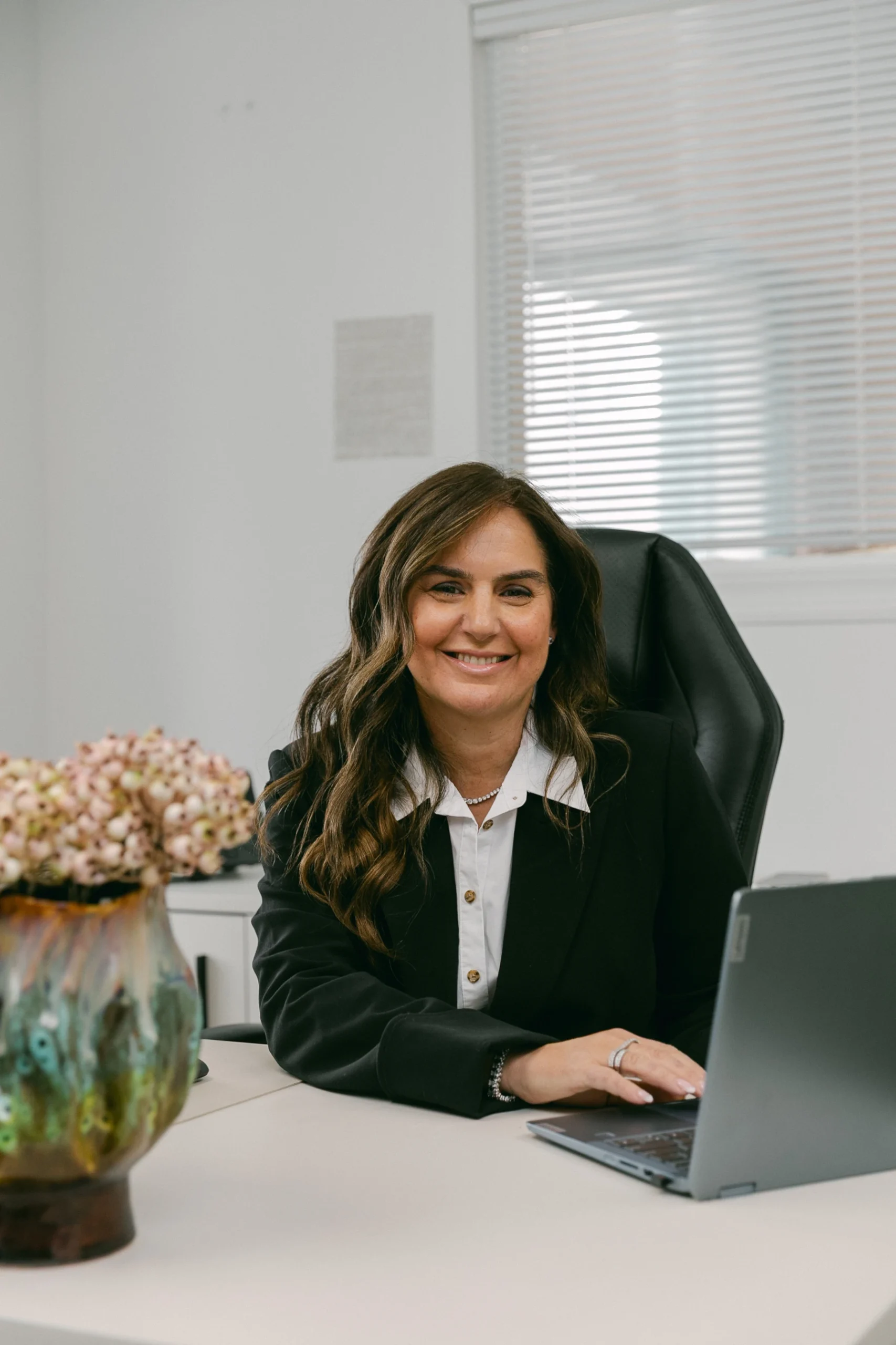 Sandra Lazar smiling on her desktop